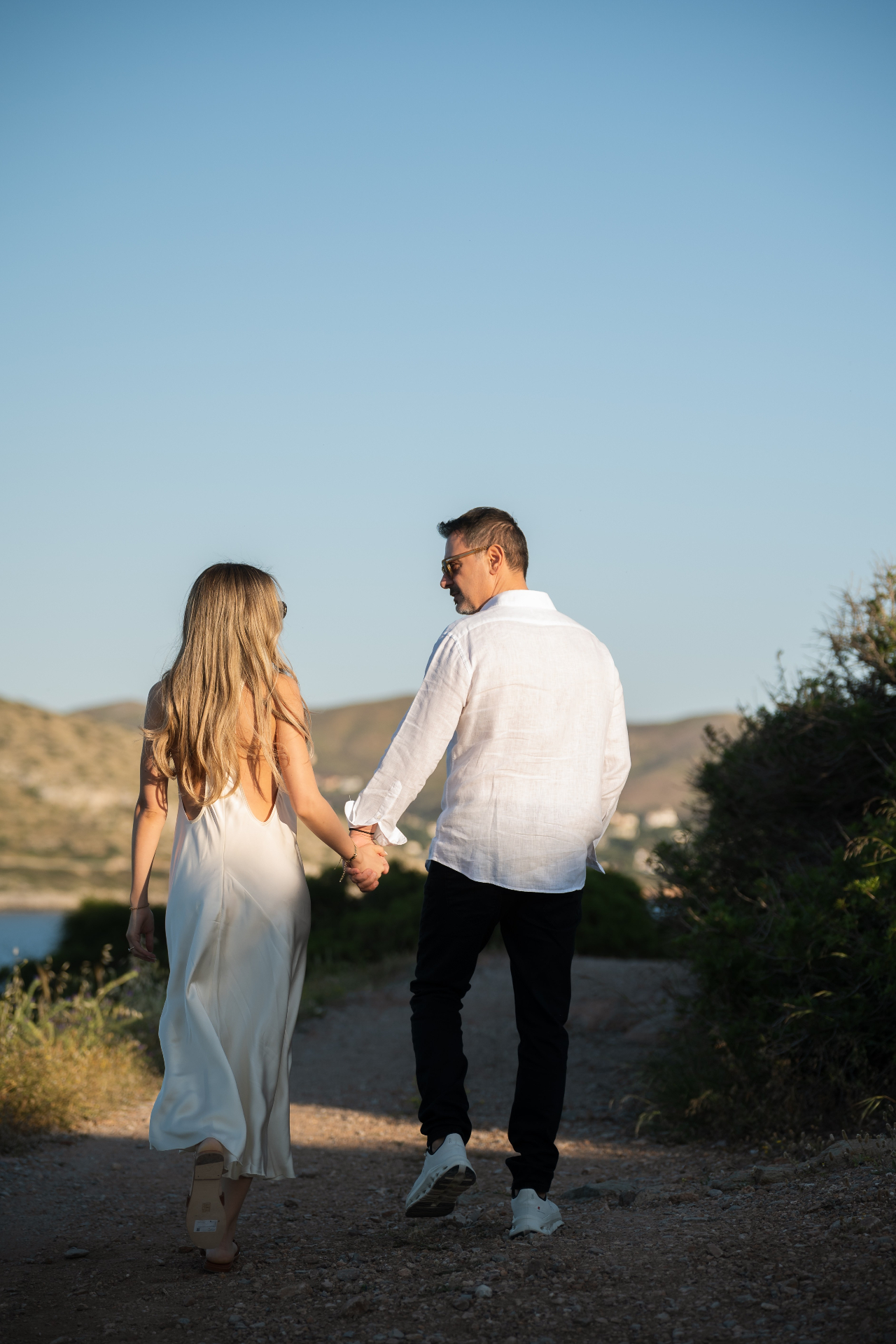 Takis and Xenia walking hand in hand